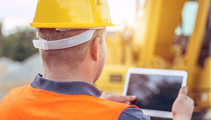 filed operator using a tablet to capture data in an inspection process