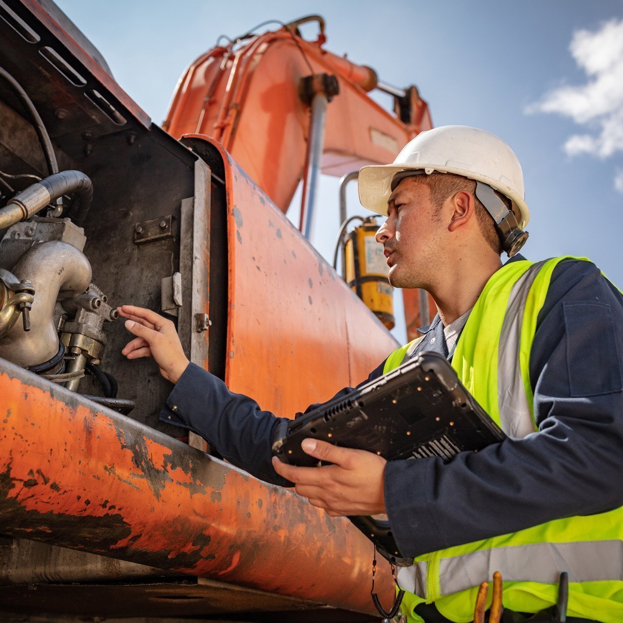 machine inspector performing regular inspections using a digital tool smartflow and a rugged tablet