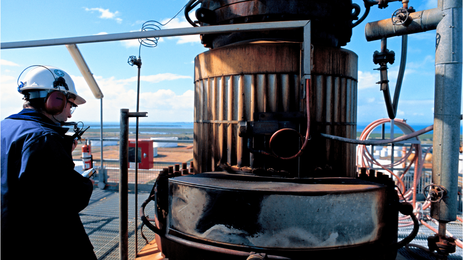 oil and gas inspector using smartflow app to inspect oil tank terminal
