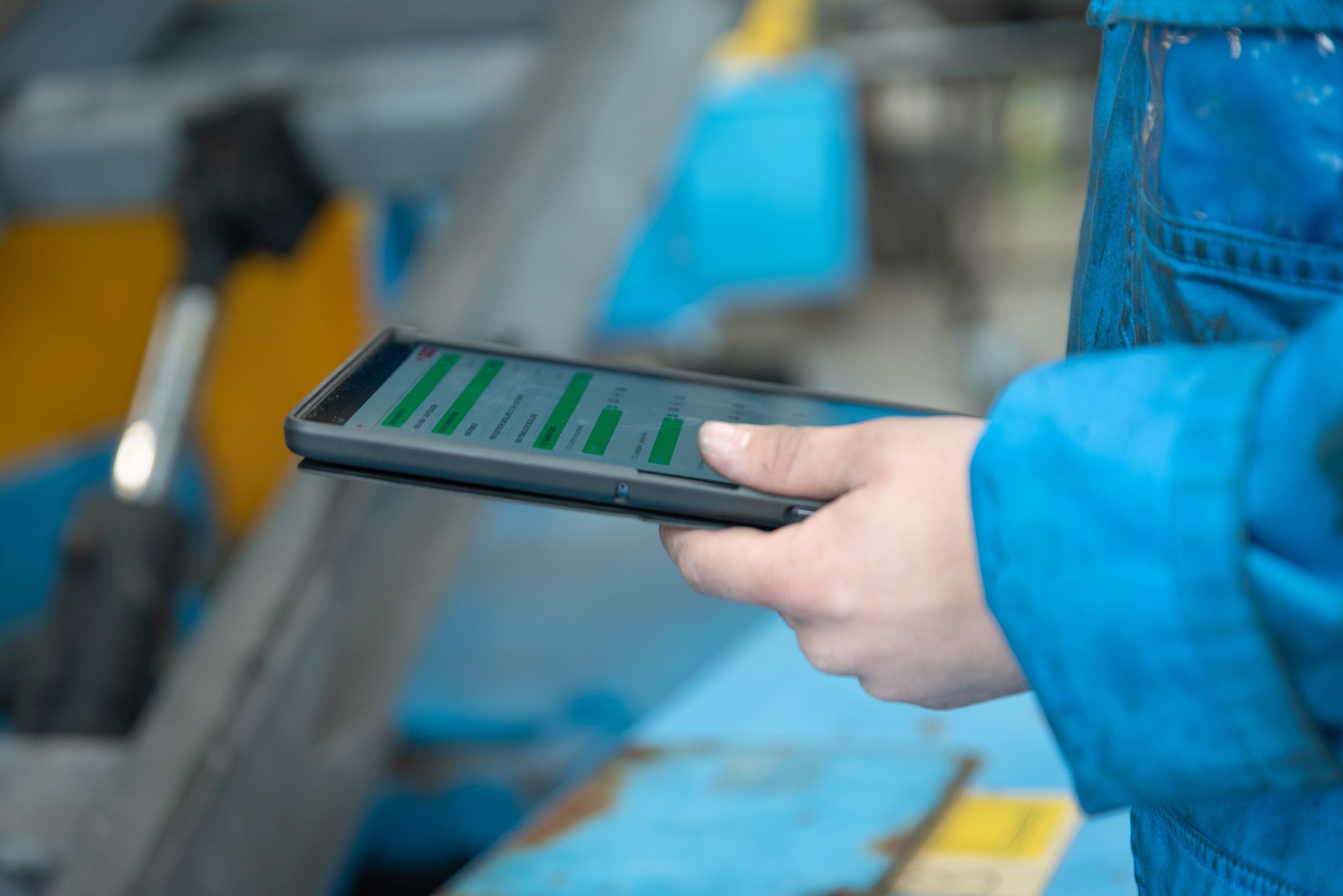 inspector holding a tablet while performing digital inspections with smartflow